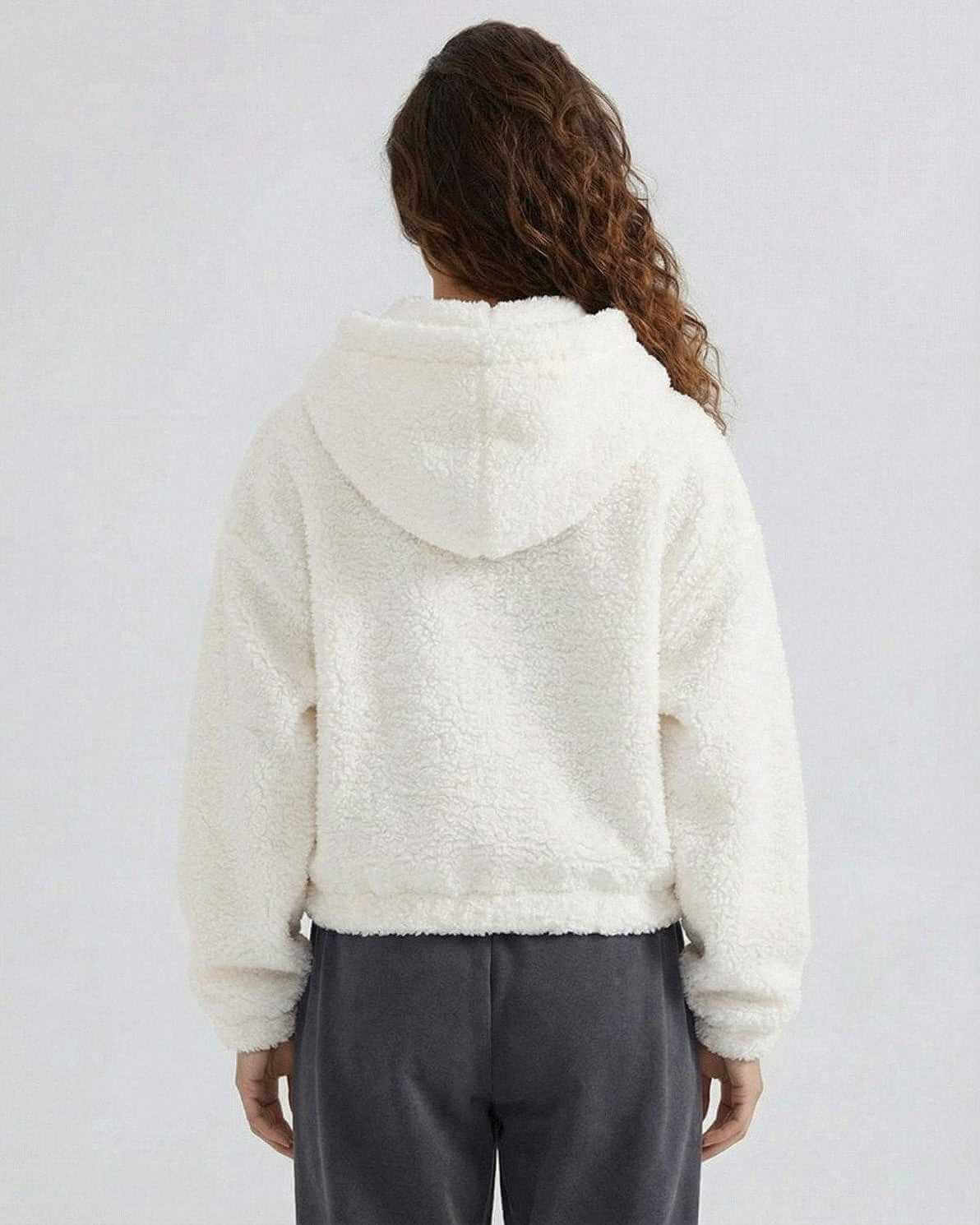 Back view of the Snow Cozy Jacket by Lauven, a women's white fleece zip jacket with a hood.