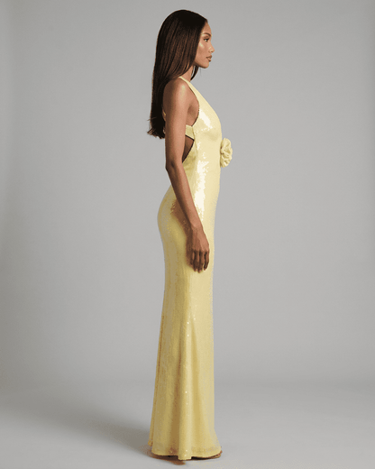Solara Maxi Dress by Lauven in yellow with backless V-neck silhouette and floral sequin detail.