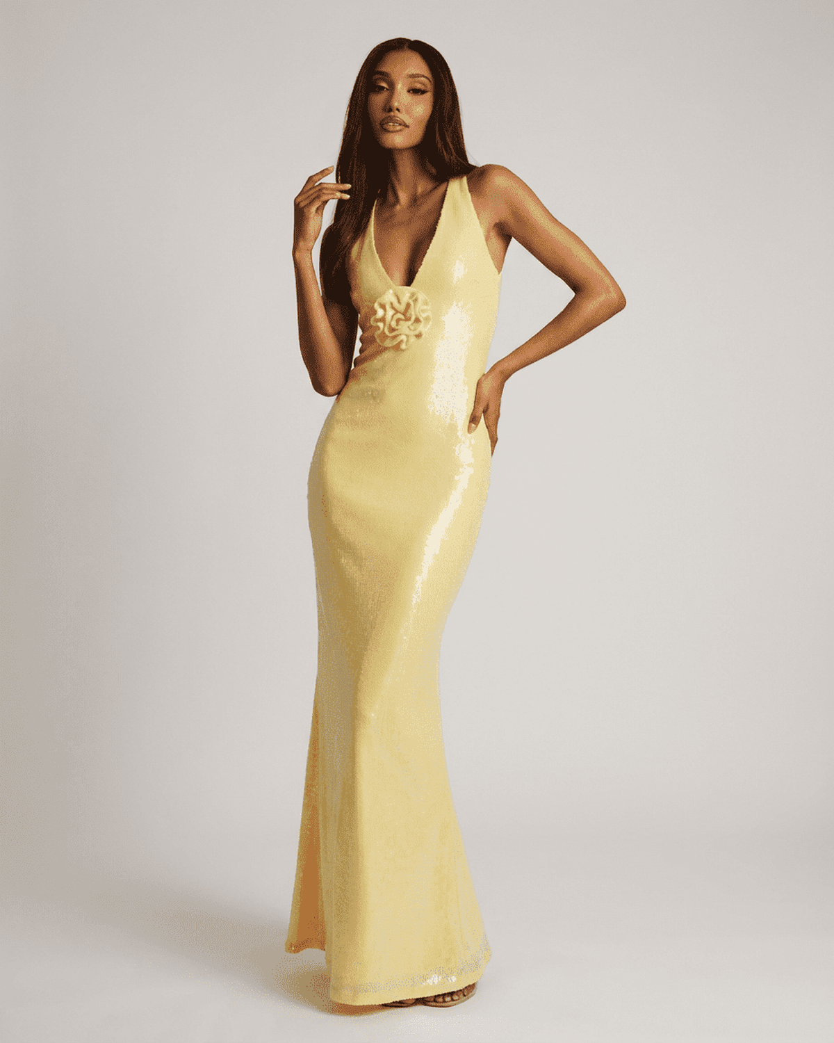 Solara Maxi Dress by Lauven, featuring a backless V-neck and floral sequin detail in luminous yellow.