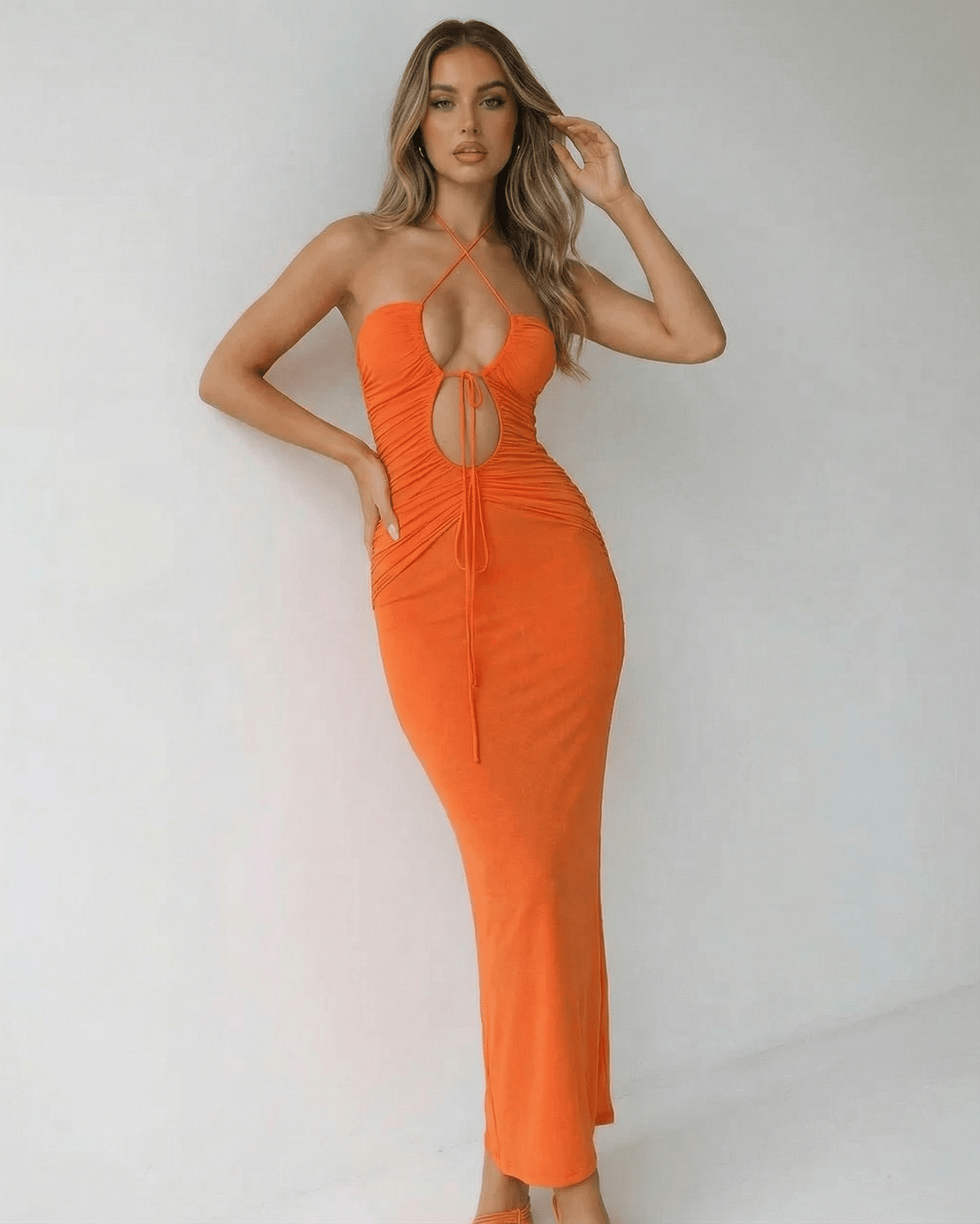 Solara Maxi Dress by Lauven - Elegant orange ankle-length halter neck dress with ruched detailing.