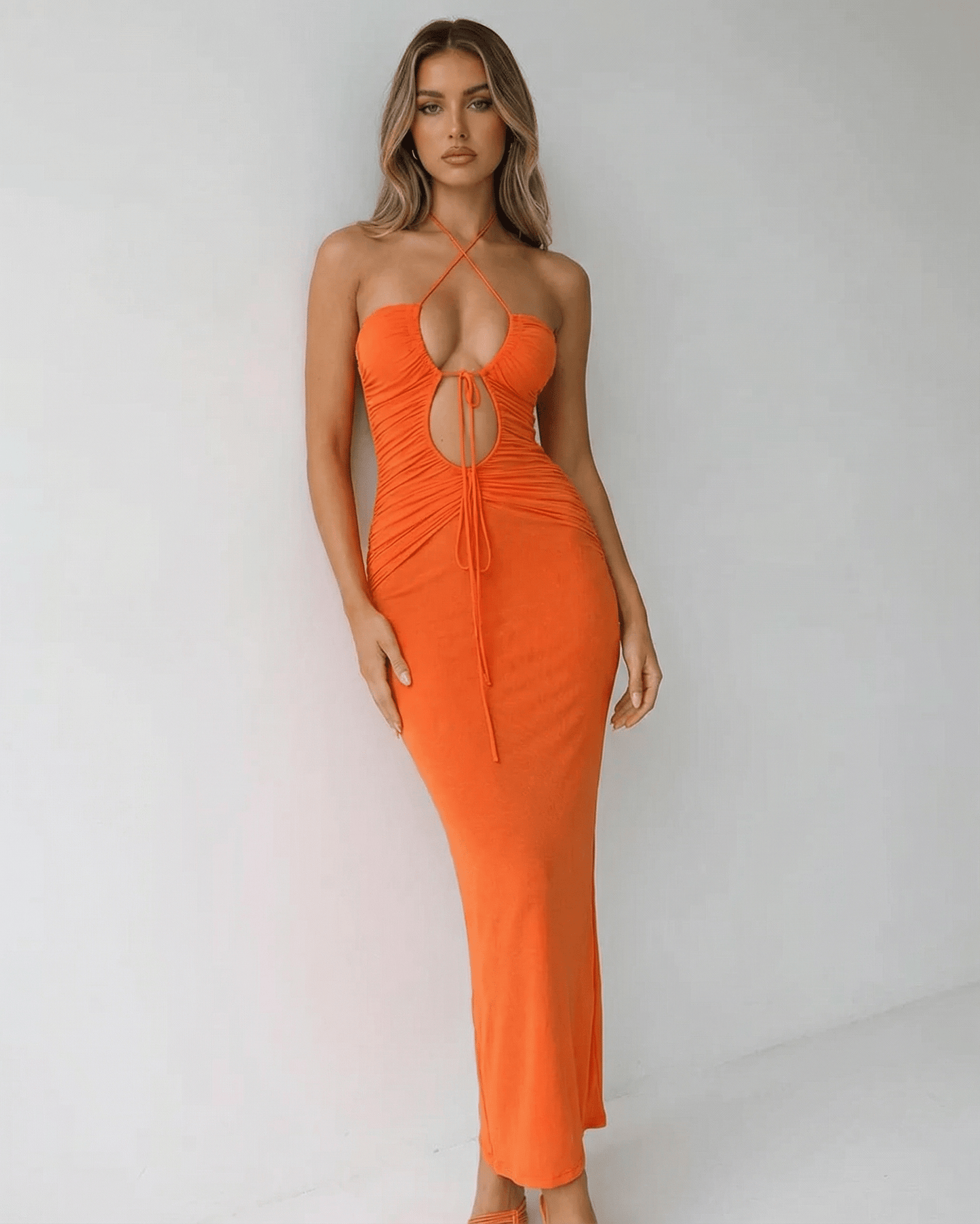 Solara Maxi Dress by Lauven - Halter neck, ruched detail, ankle-length, vibrant orange fabric.
