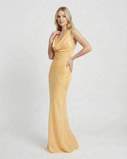 Elegant model in a satin-effect Solara Maxi Dress by Lauven, showcasing a cowl neck and floor-length silhouette.