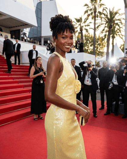 Solara Maxi Dress by Lauven, featuring a backless design with floral sequin details at a glamorous event.