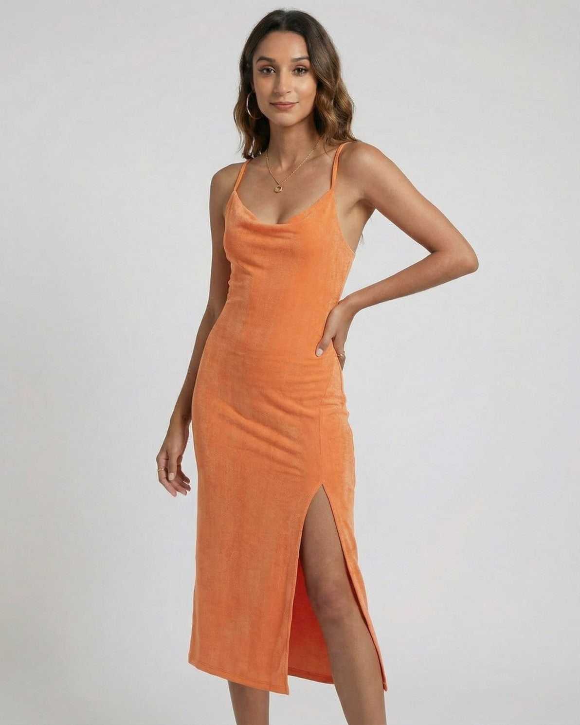 Solara Midi Dress by Lauven in vibrant orange with cowl neck, sleeveless design, and elegant side slit.