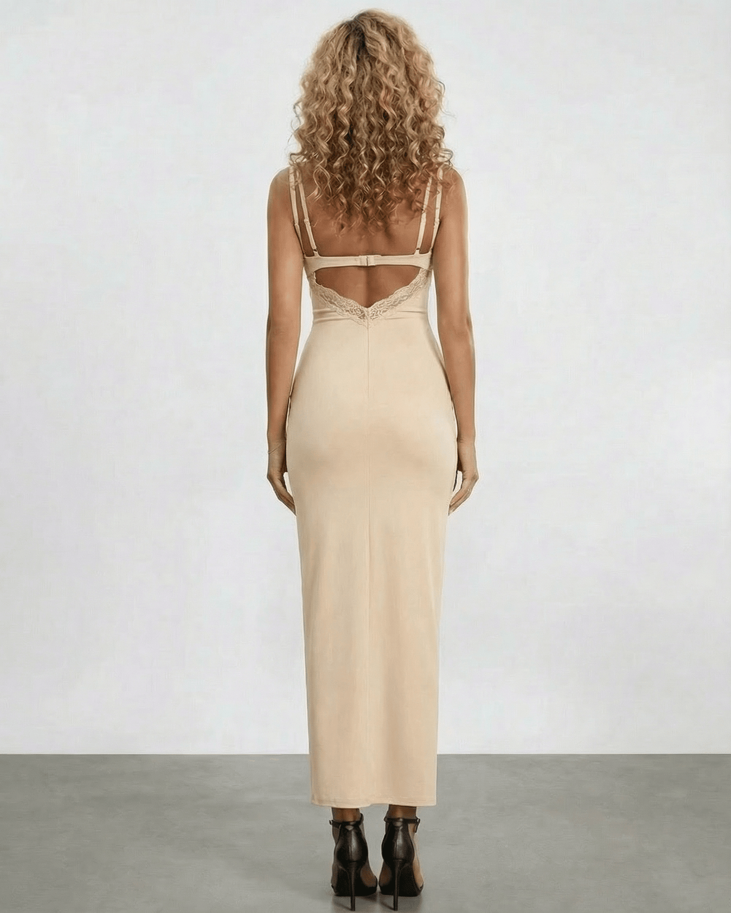 Back view of Solene Maxi Dress by Lauven featuring lace panel and spaghetti straps in a neutral tone.