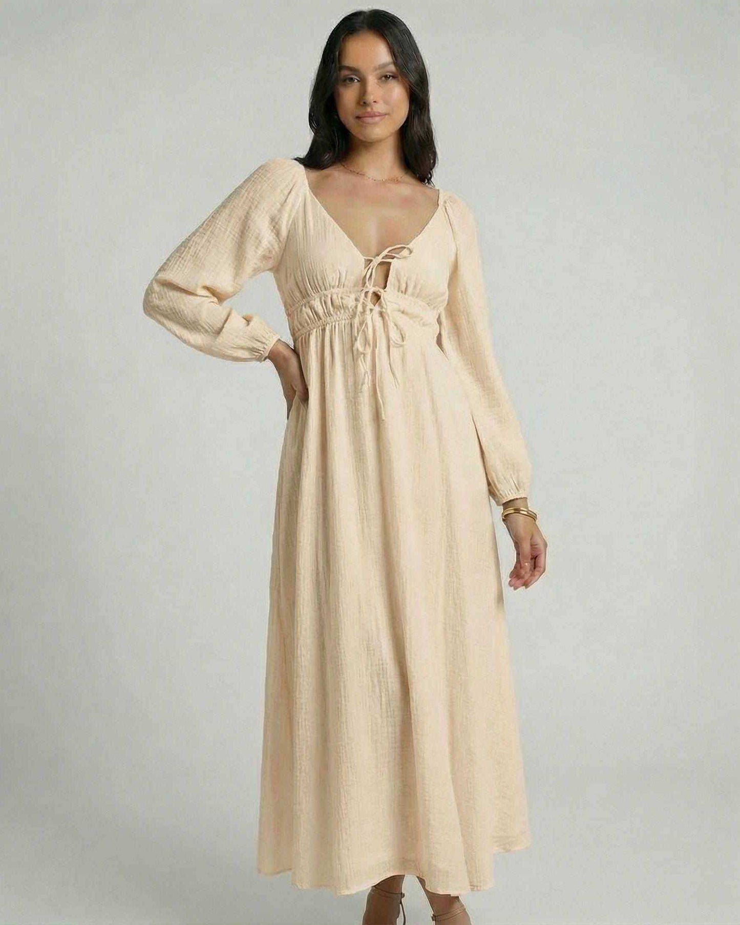 Solenne Maxi Dress by Lauven, featuring a beige V-neck, ankle-length silhouette, and flowing design.