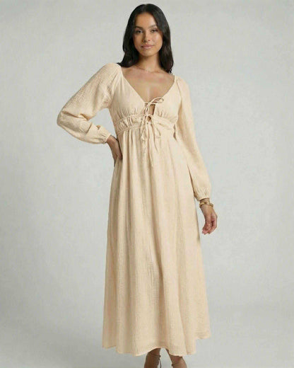 Solenne Maxi Dress by Lauven, featuring a beige V-neck, ankle-length silhouette, and flowing design.
