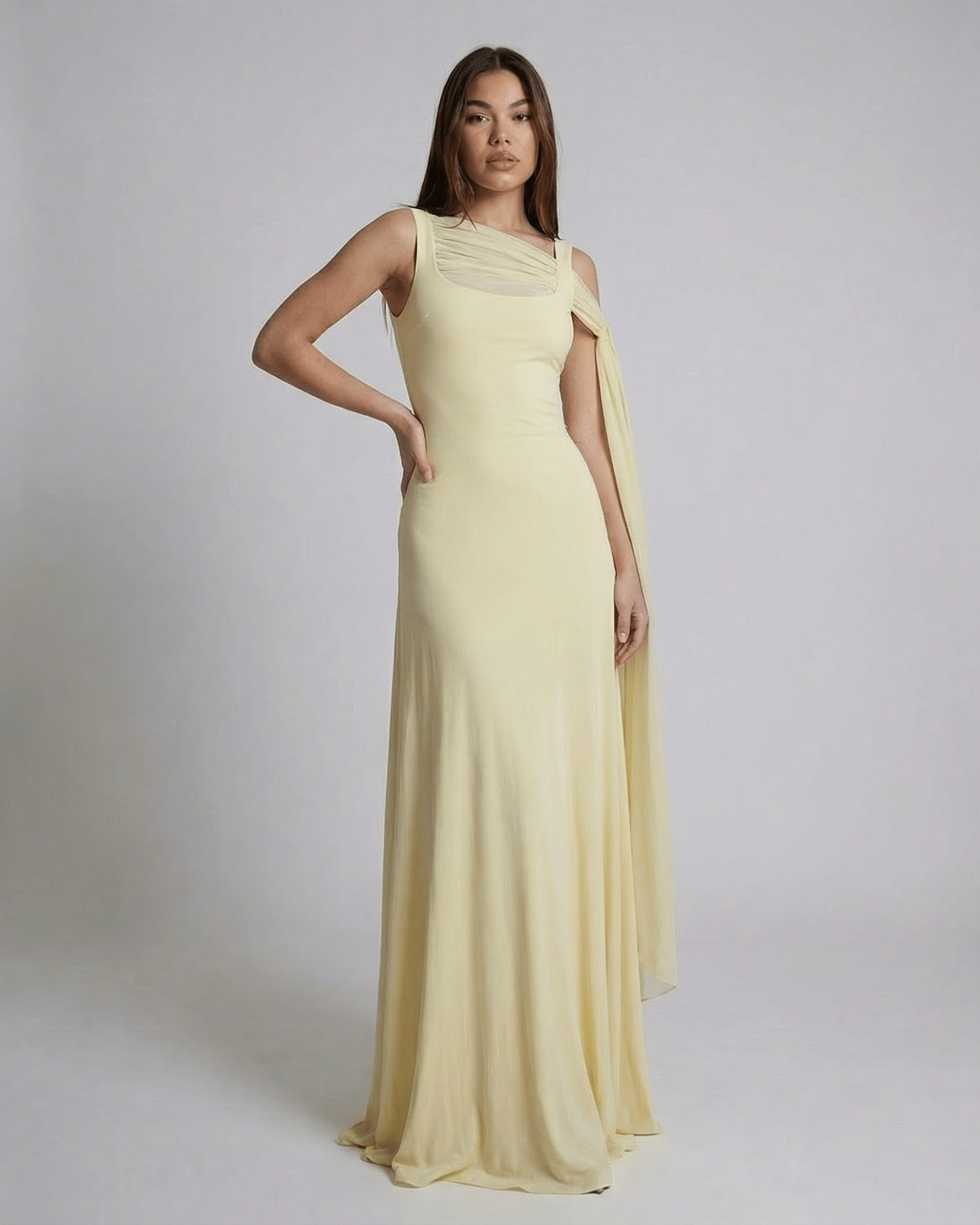 Solenne Maxi Dress by Lauven showcasing a light yellow slip maxi dress with a clean square neckline and mesh shawl detail.