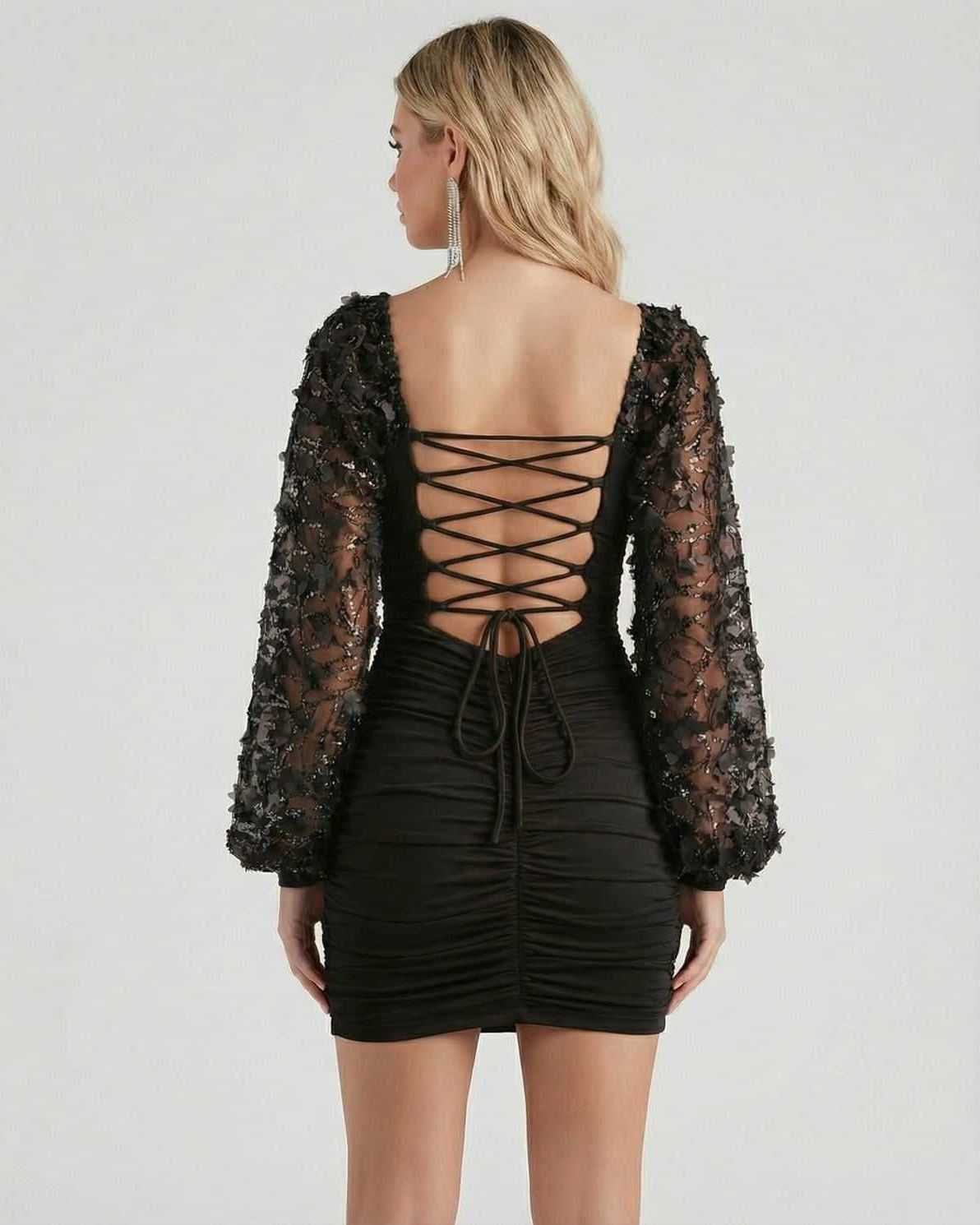 Stella Mini Dress by Lauven featuring elegant back design and embellished lantern sleeves in sophisticated black.