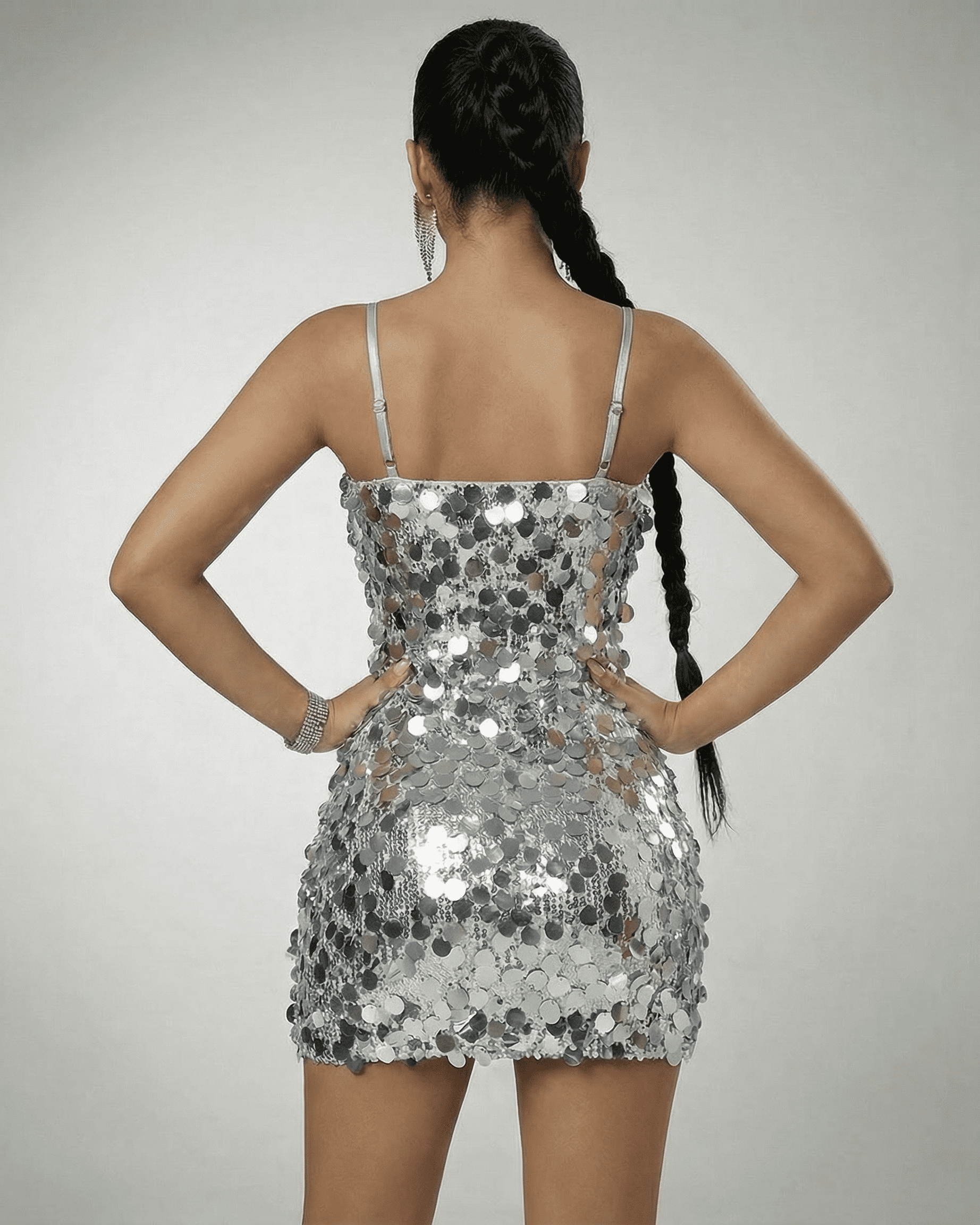 Stella Mini Dress by Lauven, silver sequin off-the-shoulder dress showcasing a high-waist silhouette from the back.