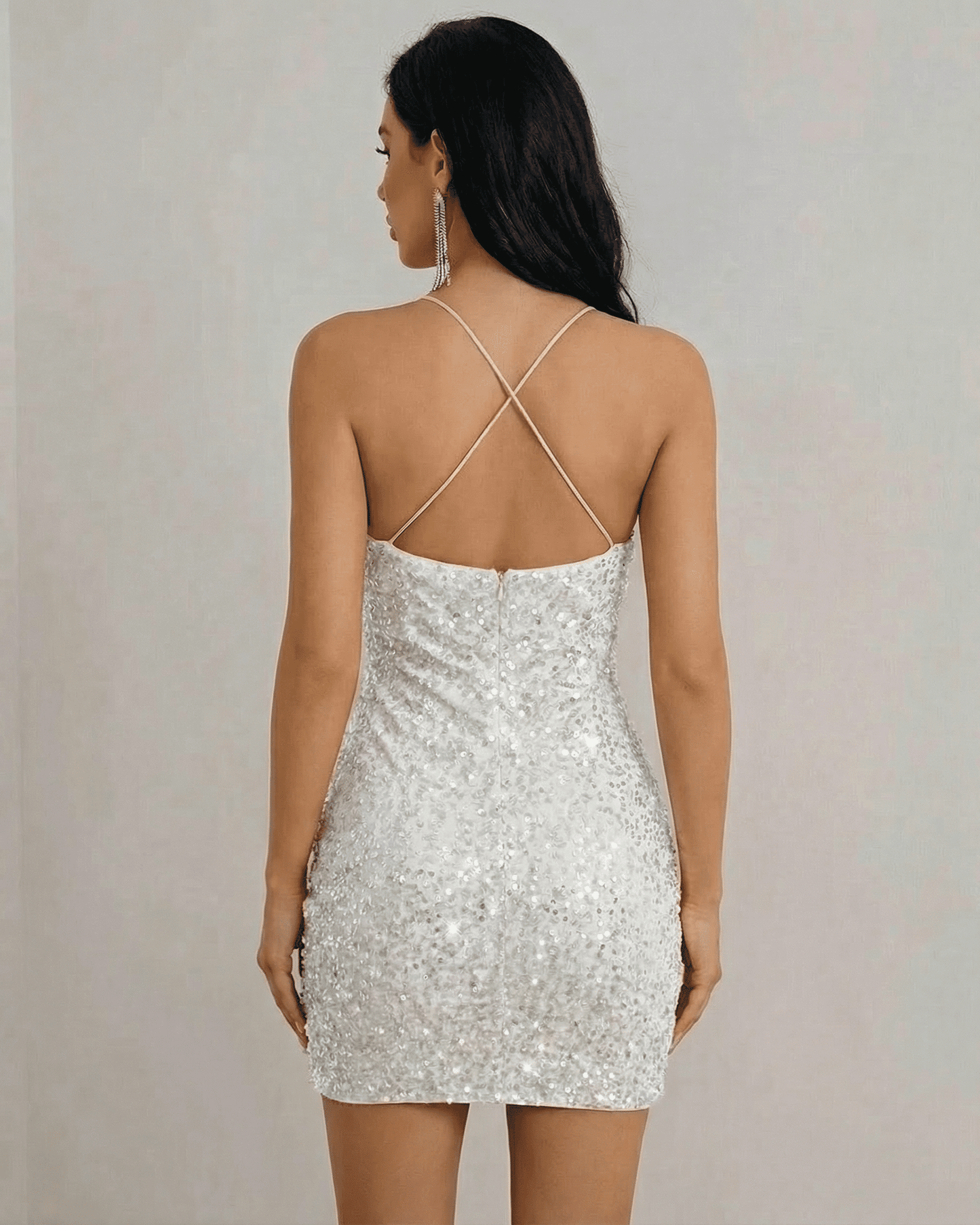 Stella Mini Dress by Lauven, back view showcasing white sequin fabric and halter neckline design.