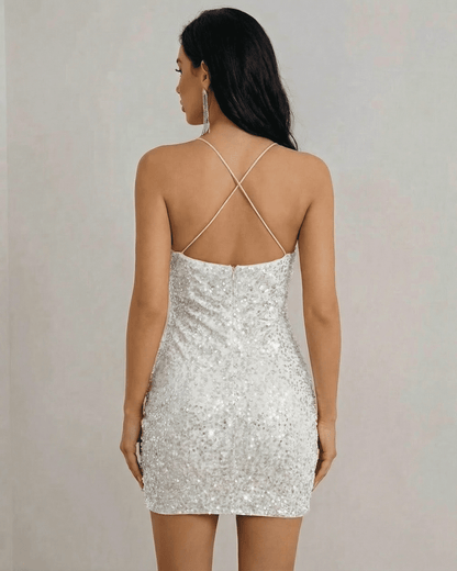 Stella Mini Dress by Lauven, back view showcasing white sequin fabric and halter neckline design.
