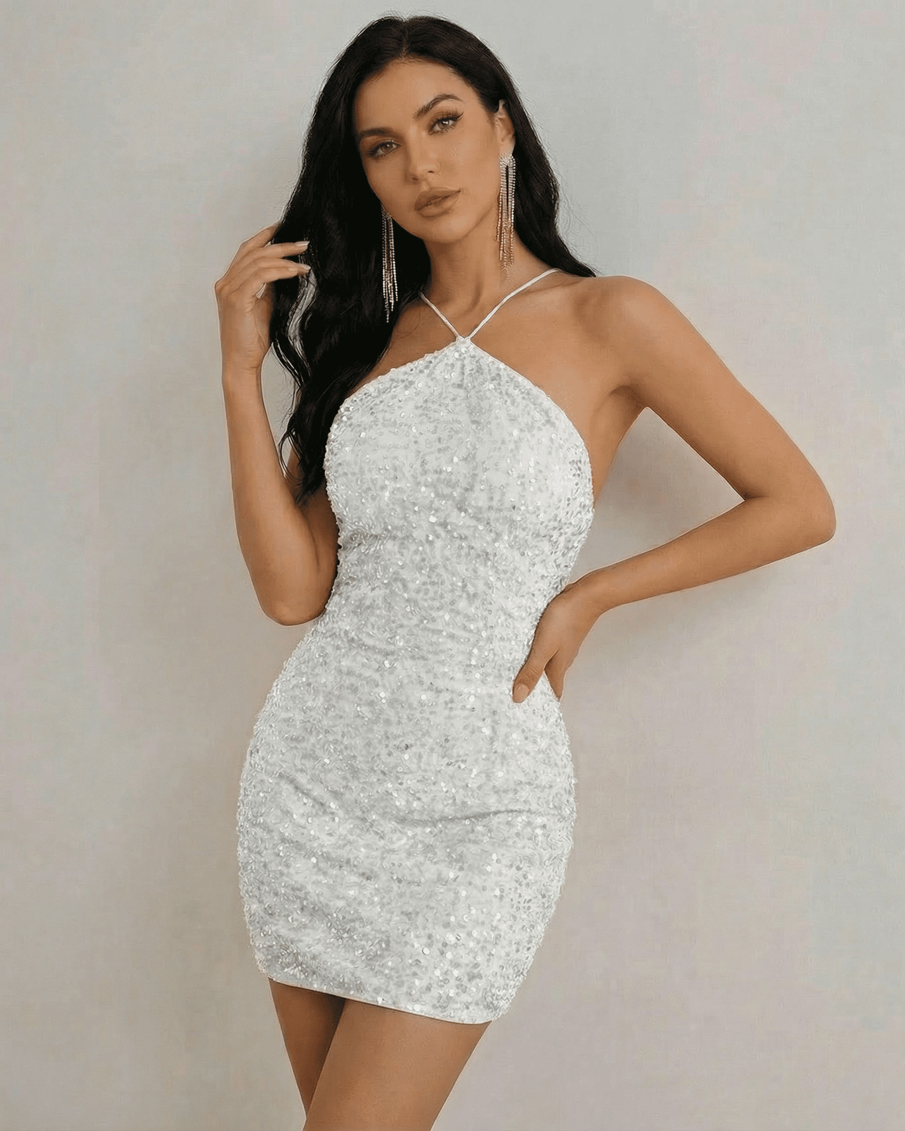 Stella Mini Dress by Lauven, dazzling white sequin halter neck mini dress with a high-waist silhouette.