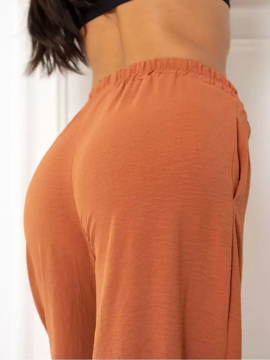 Terracotta Suit Set by Lauven, showcasing elegant oversized pants in warm brown with a relaxed fit.