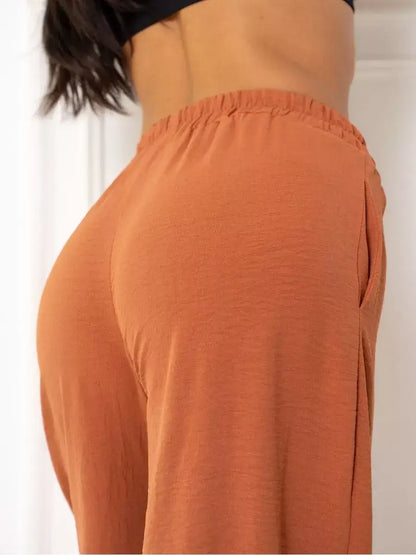 Terracotta Suit Set by Lauven, showcasing elegant oversized pants in warm brown with a relaxed fit.