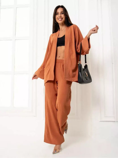 Terracotta Suit Set by Lauven - Elegant oversized two-piece set in warm brown, featuring wide-leg pants and a stylish top.