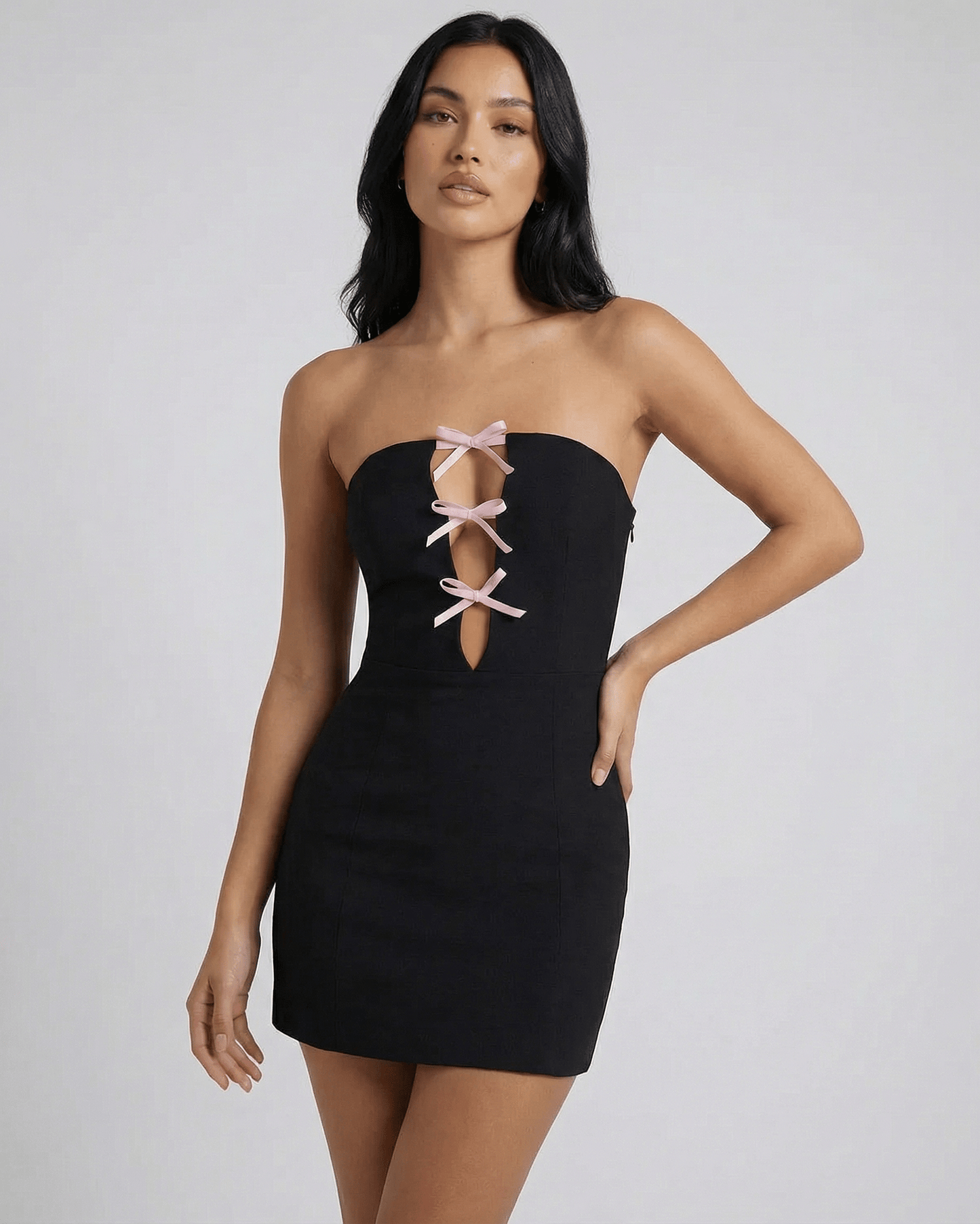 Valencia Mini Dress by Lauven, featuring stylish bow detail and a slim sheath silhouette in a sleek black design.