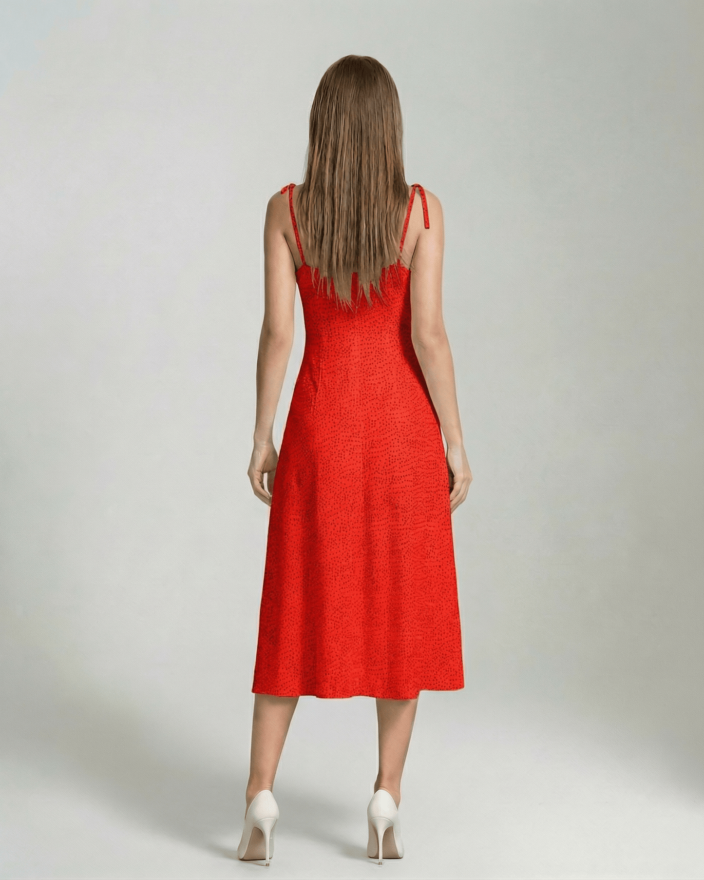 Vega Midi Dress by Lauven, bold red A-line dress with a sleeveless cami-style neckline viewed from the back.