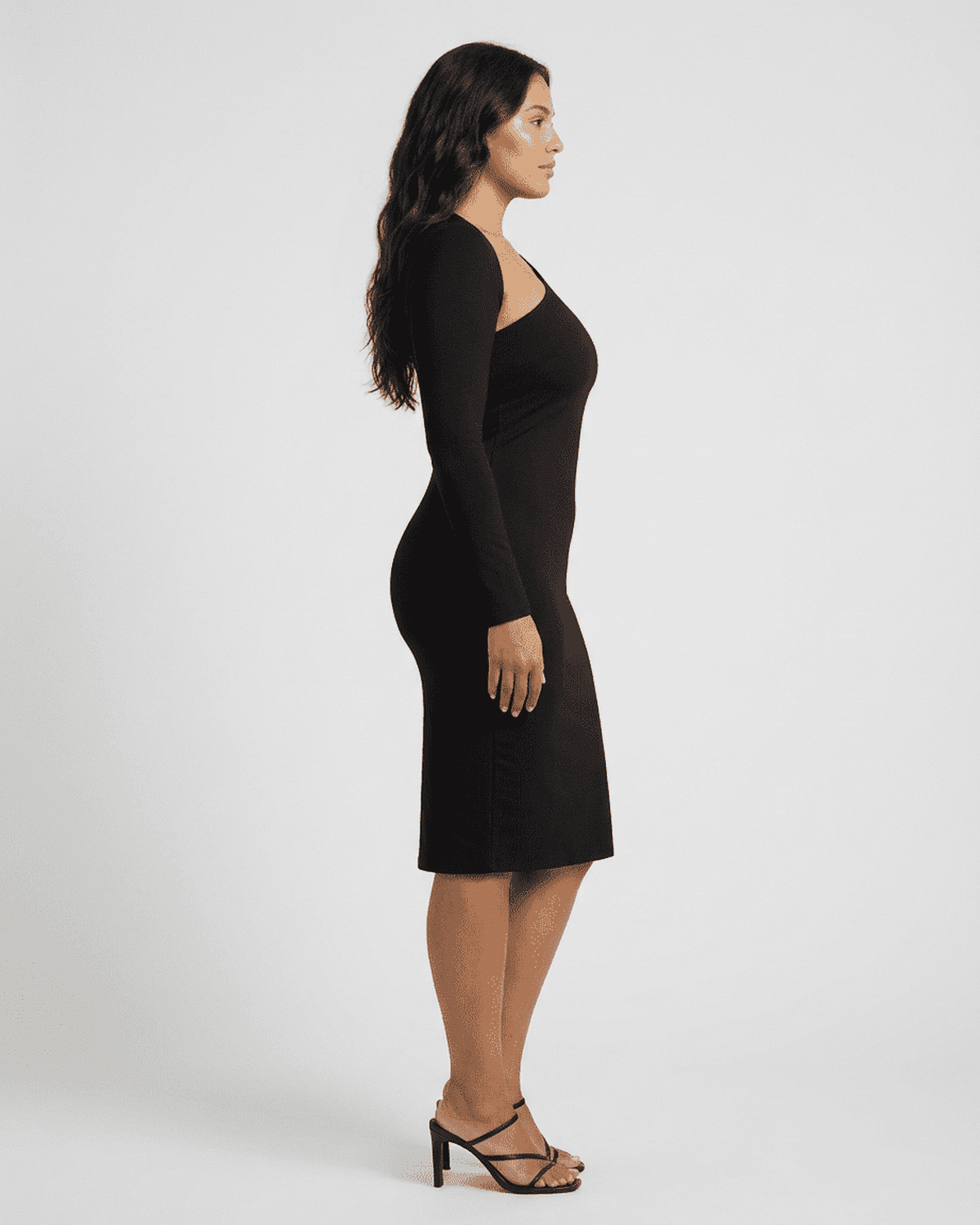 Vega Midi Dress by Lauven displayed on a model from the side showcasing its chic one-shoulder design and bodycon fit.