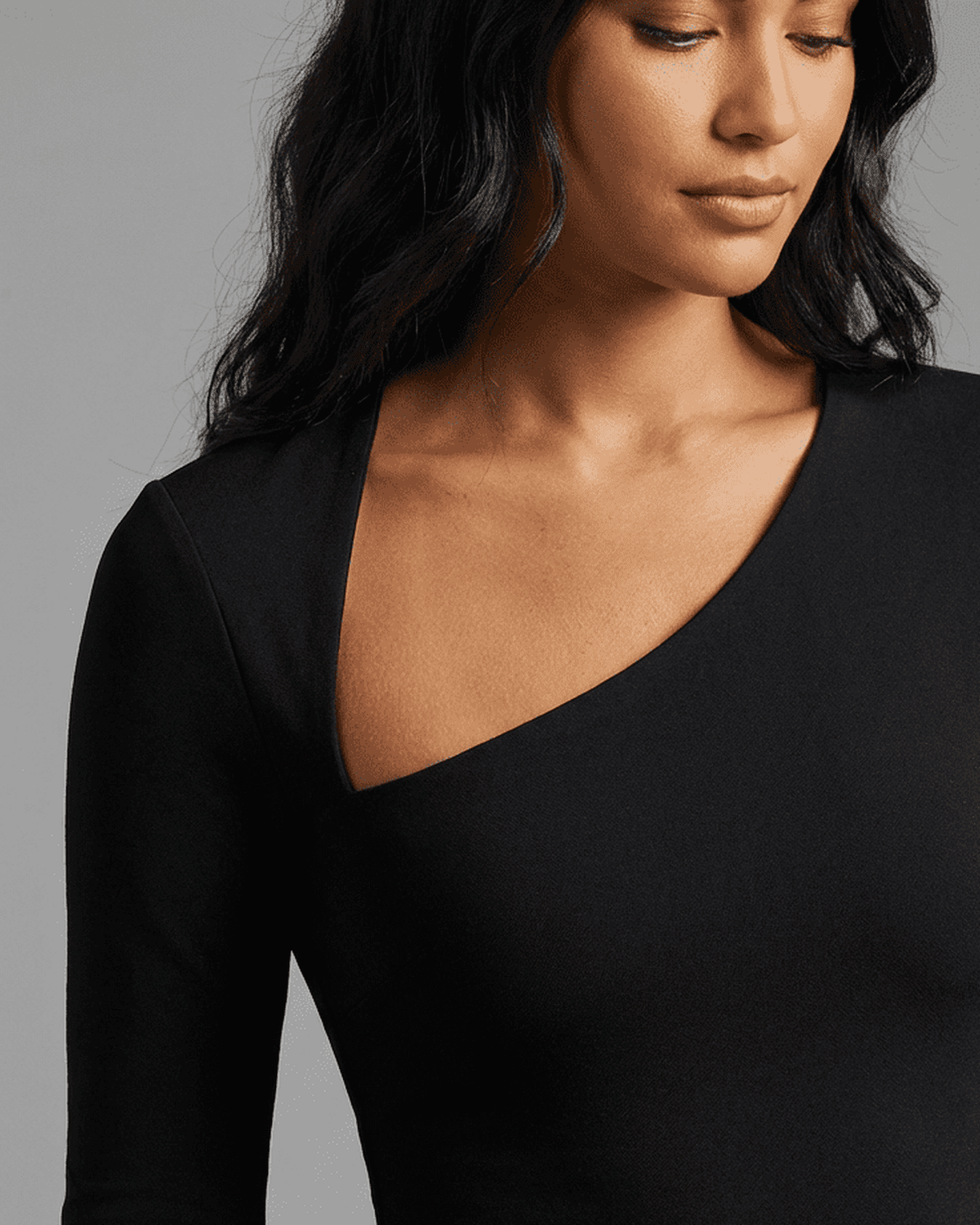 Vega Midi Dress by Lauven, showcasing a stylish one-shoulder design and smooth knit fabric for a flattering fit.