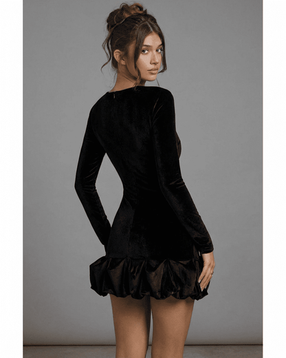 Velora Mini by Lauven – Black velvet bodycon dress with long sleeves and pleated hem, showcasing a luxe silhouette.