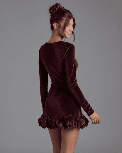 Velora Mini Dress by Lauven, showcasing deep burgundy velvet fabric and a pleated hem design.