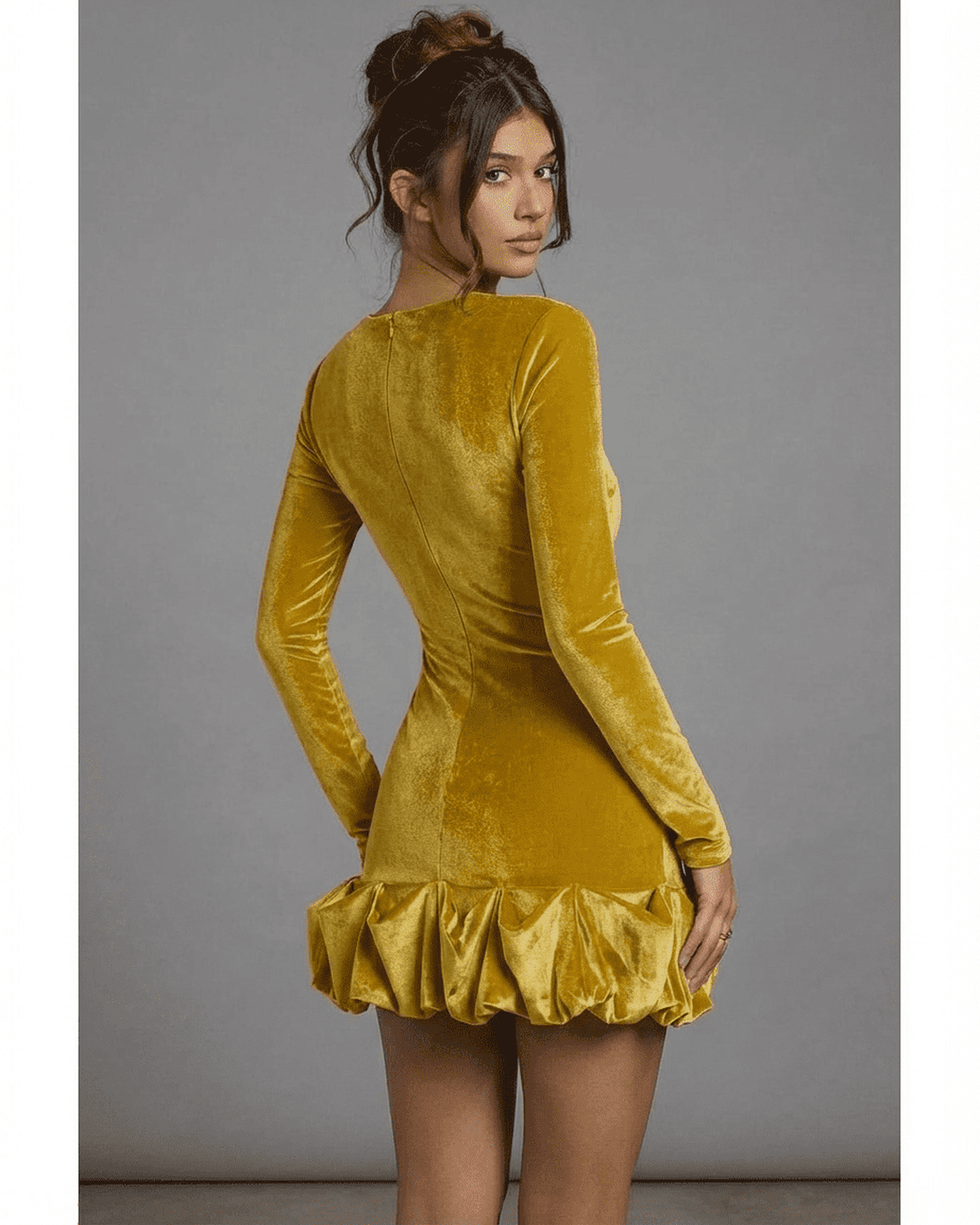 Back view of Velora Mini Yellow by Lauven, featuring a luxe velvet texture and pleated hem detail.