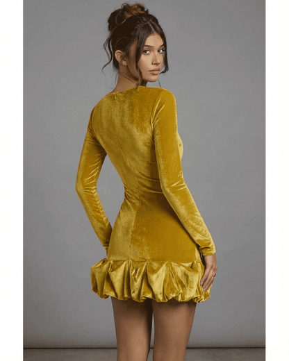 Back view of Velora Mini Yellow by Lauven, featuring a luxe velvet texture and pleated hem detail.