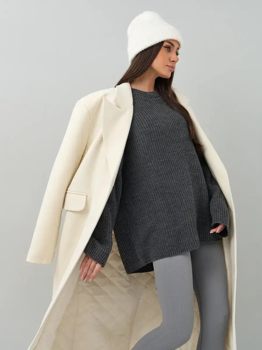 Model wearing the Vera Sweater by Lauven, an oversized dark gray knit with a crew neck and stylish winter outfit.