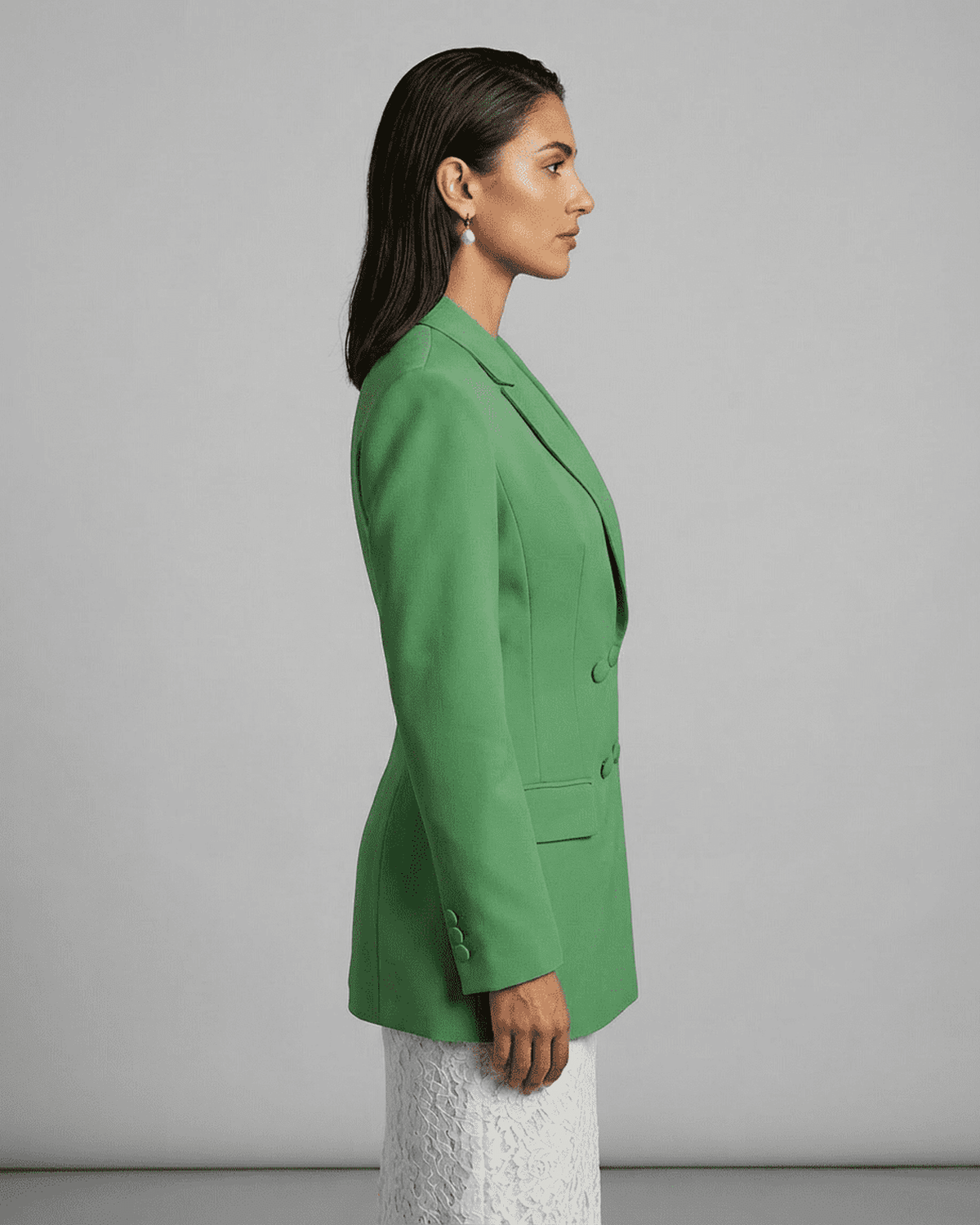 Verona Blazer by Lauven, showcasing a side view of a green double-breasted tailored silhouette.
