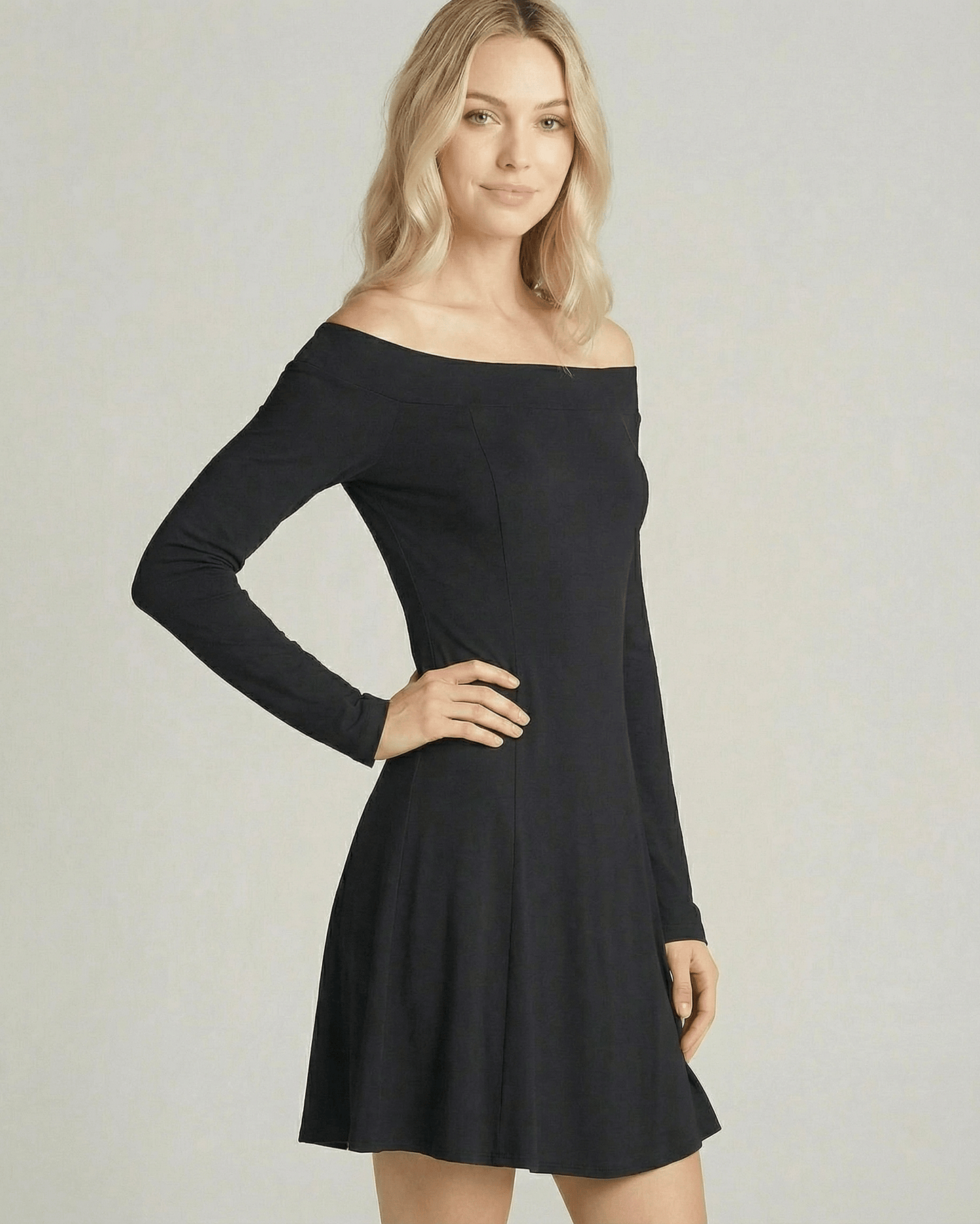 Verona Mini Dress by Lauven featuring an off-shoulder neckline and A-line silhouette in a smooth black fabric.