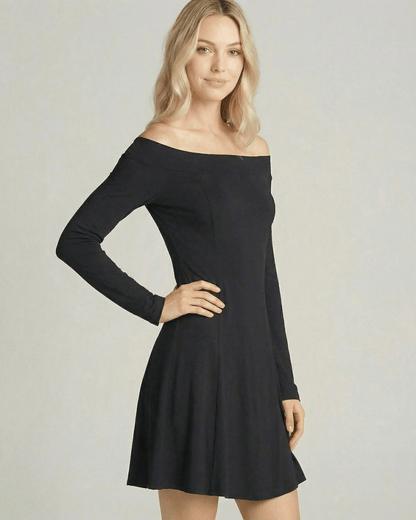 Verona Mini Dress by Lauven featuring an off-shoulder neckline and A-line silhouette in a smooth black fabric.