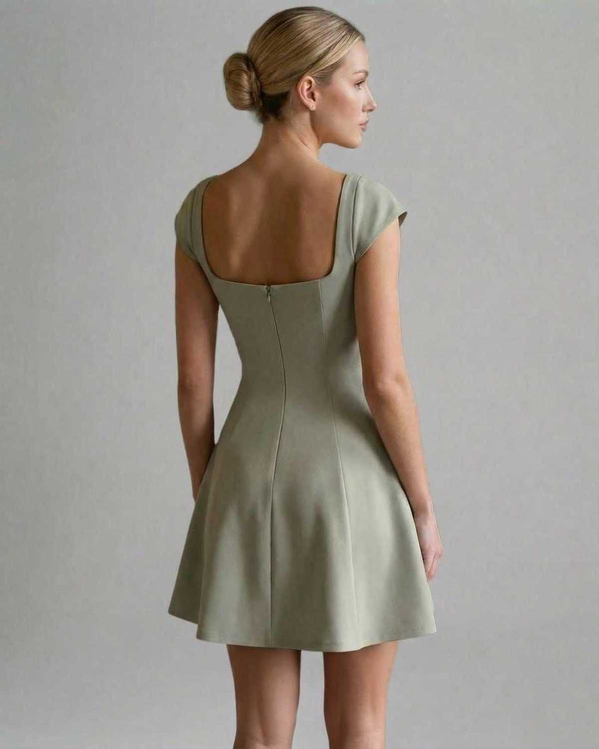 Verona Mini Dress by Lauven - Back view of a panelled bodycon mini dress with short sleeves in soft fabric.