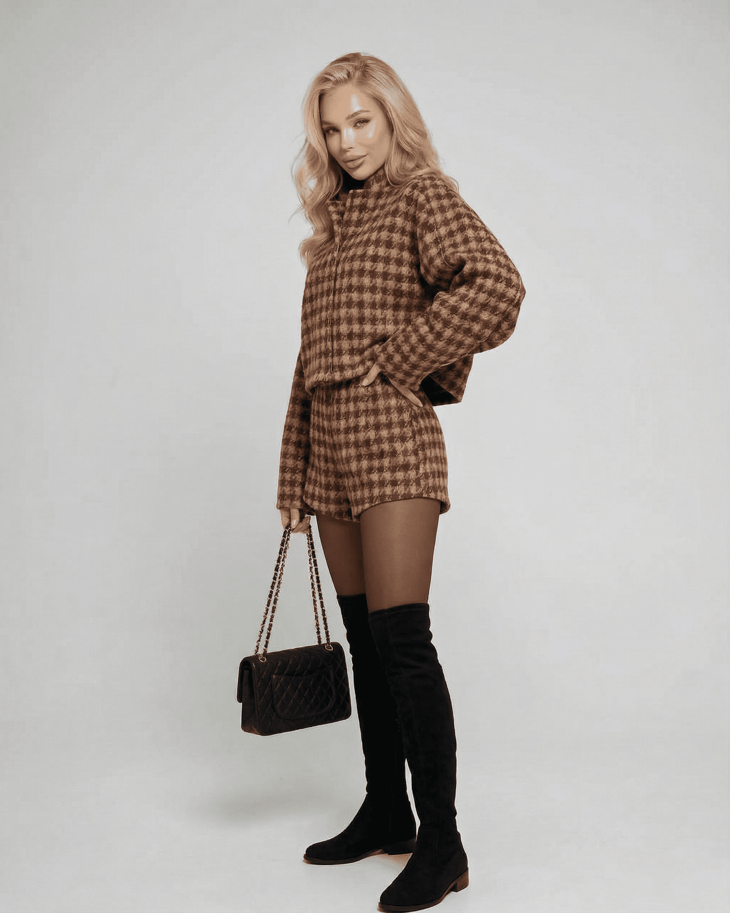 Verona Set by Lauven featuring chic tailored shorts and a structured long-sleeve top, styled elegantly.