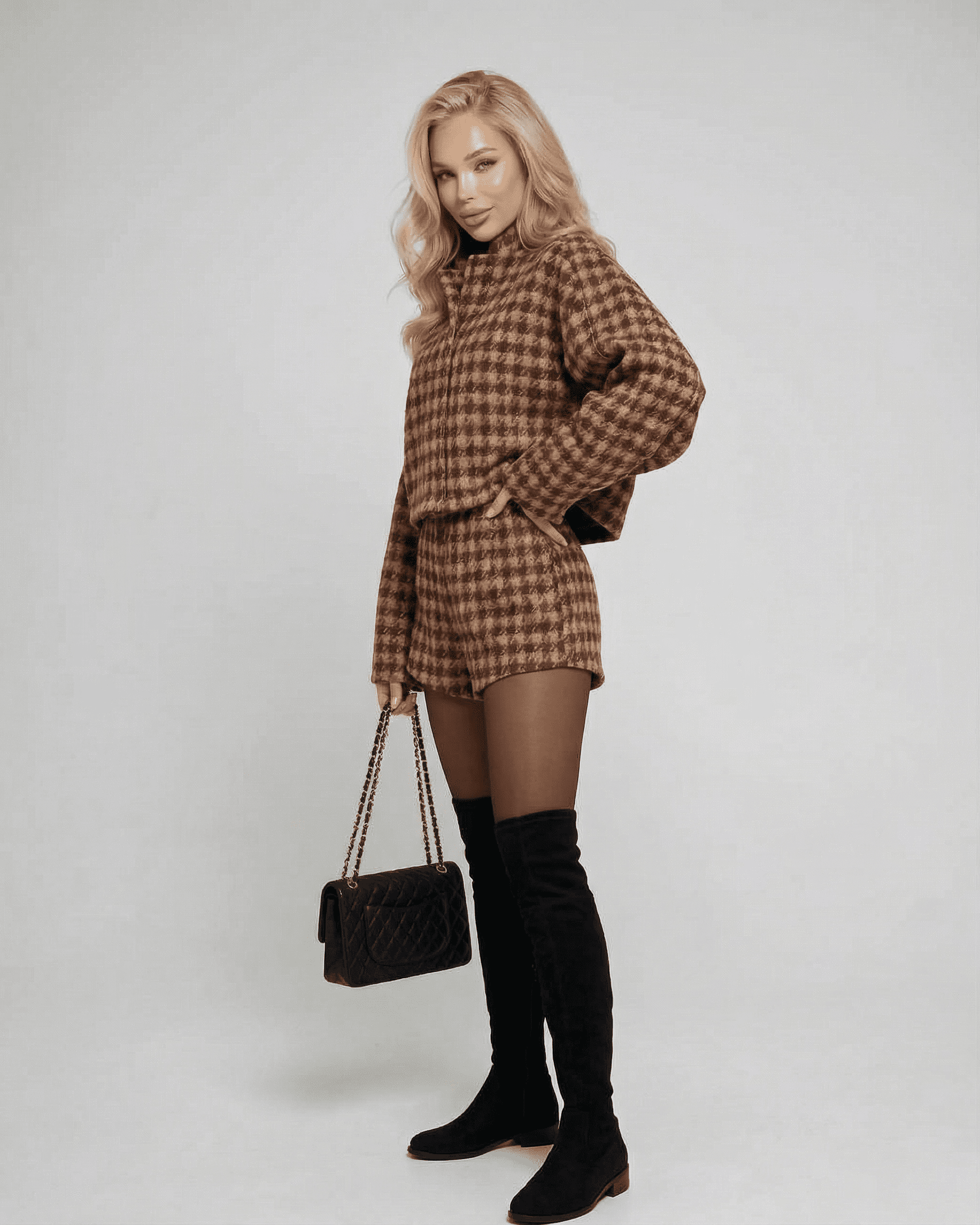 Verona Set by Lauven featuring chic tailored shorts and a structured long-sleeve top, styled elegantly.