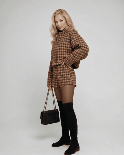 Verona Set by Lauven featuring chic tailored shorts and a structured long-sleeve top, styled elegantly.