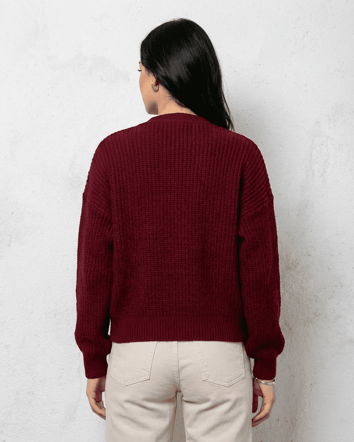 Back view of Vesper Cardigan in luxurious burgundy knitwear by Lauven, showcasing its classic design and relaxed fit.