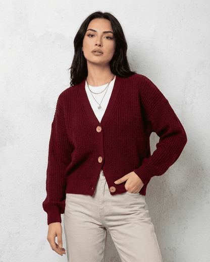 Vesper Cardigan by Lauven in luxurious burgundy knitwear with a classic V-neck design and button closure.