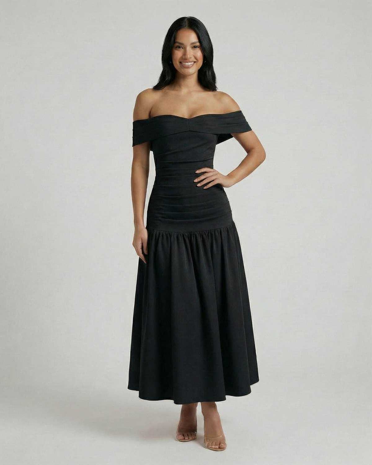 Vesper Midi Dress by Lauven, showcasing a sleek off-shoulder black design with a flattering silhouette.