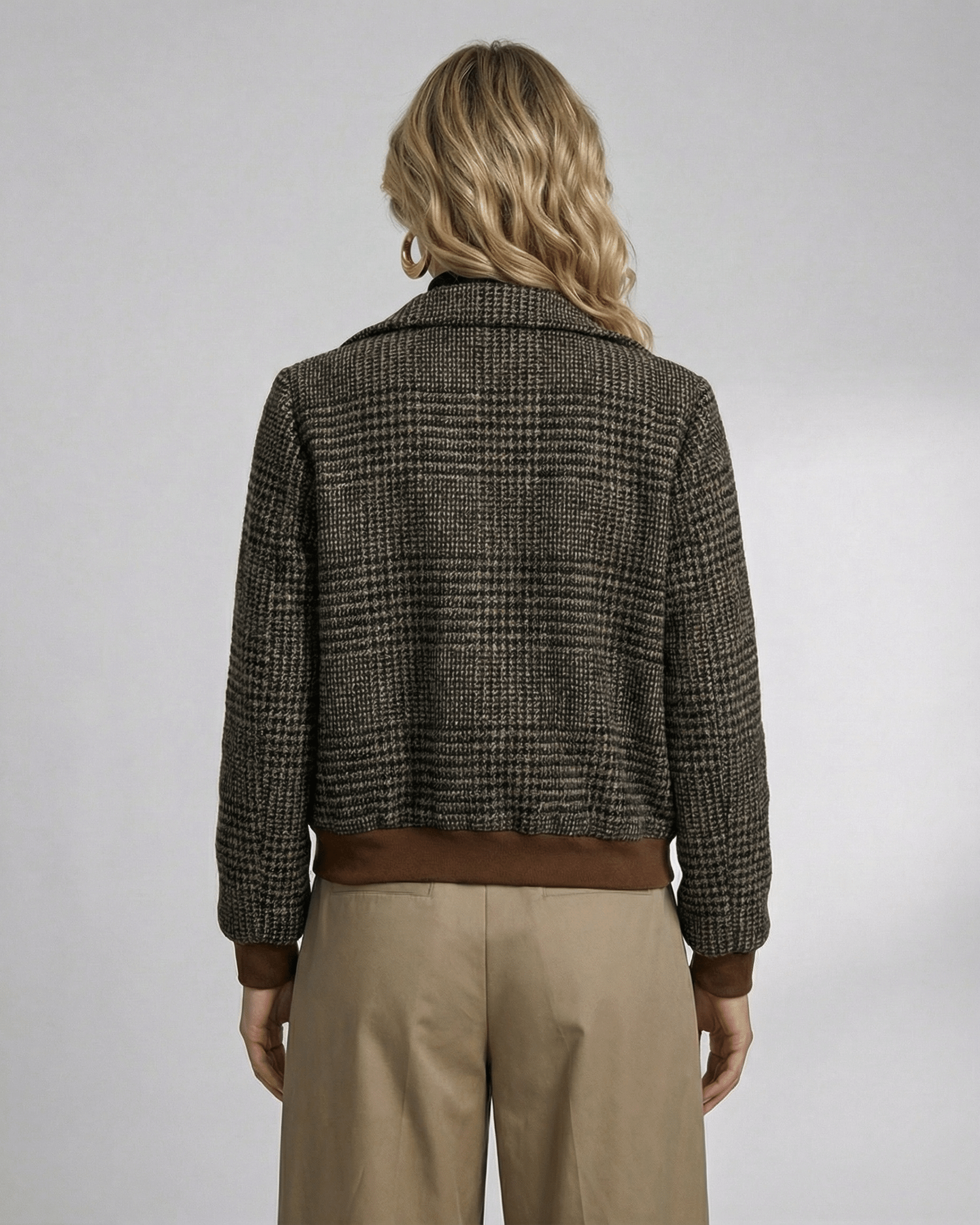 Back view of a woman in a Lauven Cambridge Jacket featuring a plaid design and stylish lapel collar.