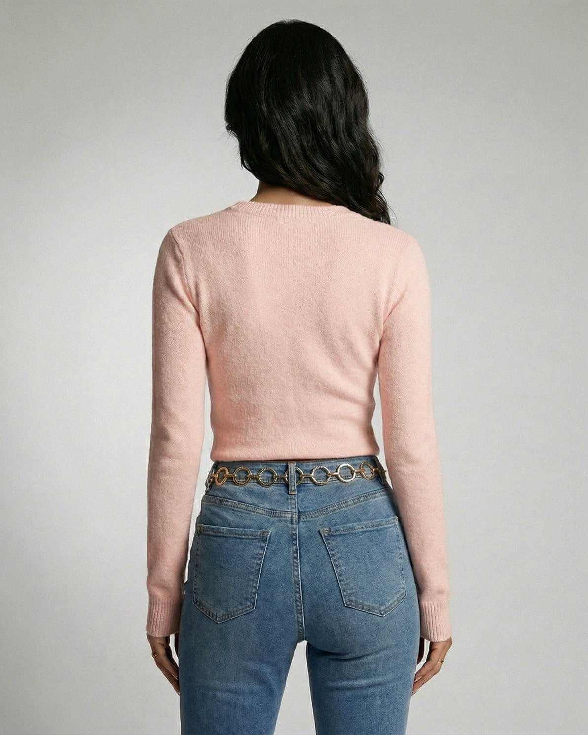 Back view of woman wearing Aria Pullover by Lauven, a pink knit pullover with a classic crew neckline.