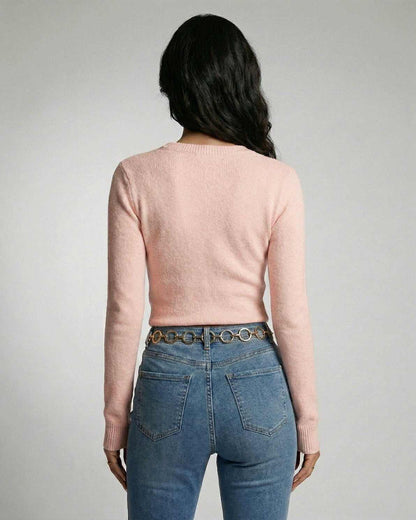Back view of woman wearing Aria Pullover by Lauven, a pink knit pullover with a classic crew neckline.