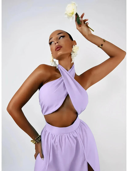 Model showcasing the Lavender Breeze Set, featuring a halter top and high-waisted maxi skirt in soft lavender.
