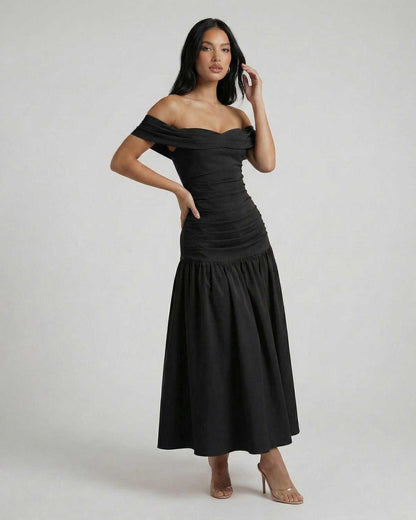 Vesper Midi Dress by Lauven, showcasing sleek off-shoulder black elegance in a modern silhouette.