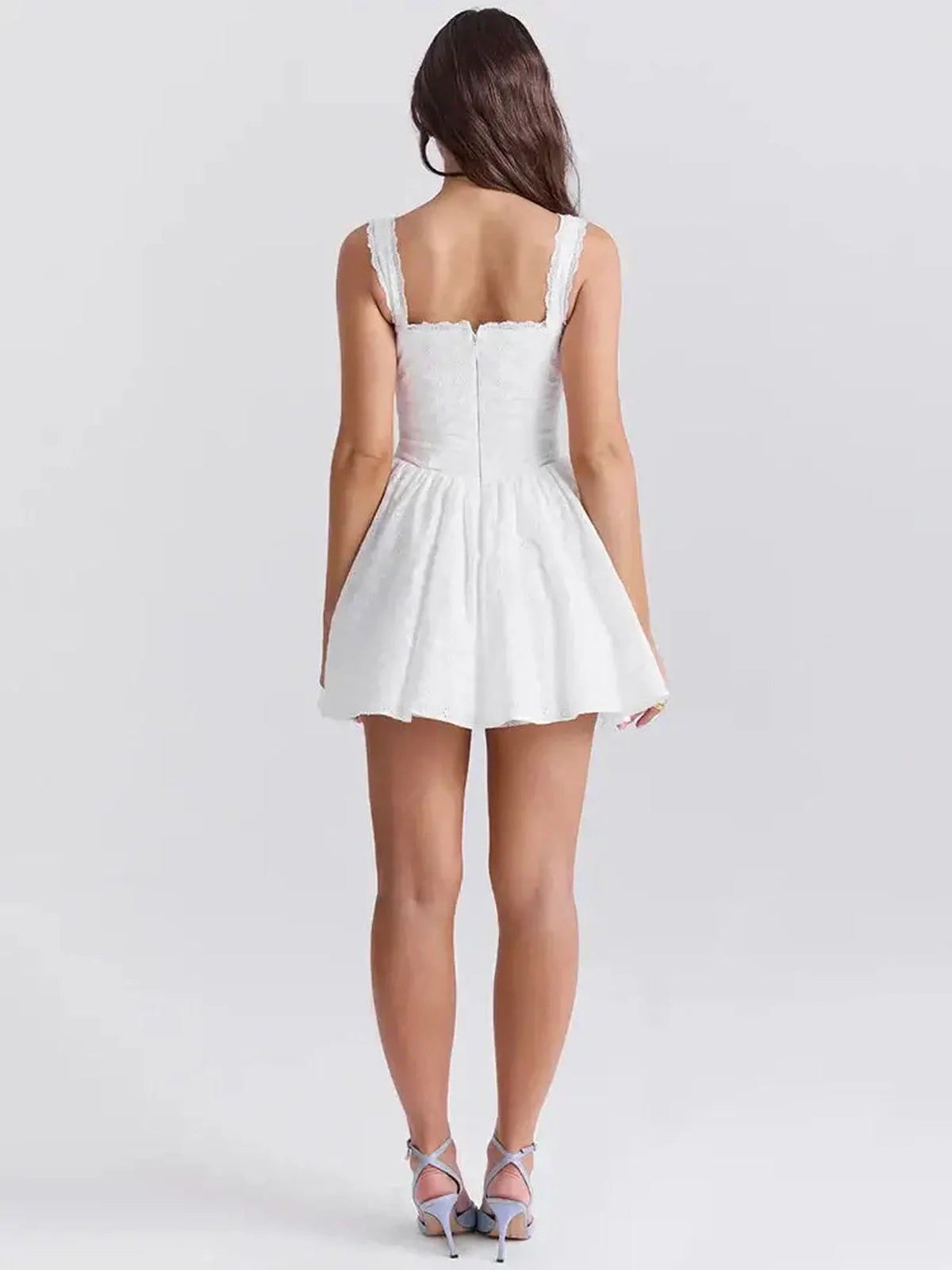 Back view of the Lea Mini Dress featuring a lace detail, perfect for summer weddings and cocktail events.