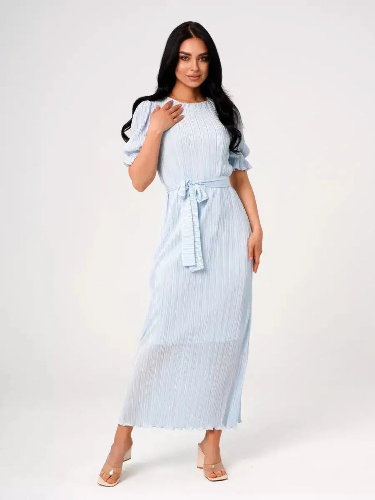 Celeste Flow Maxi Dress in light blue, featuring pleats, puff sleeves, and self-tie waistbelt, perfect for summer events.