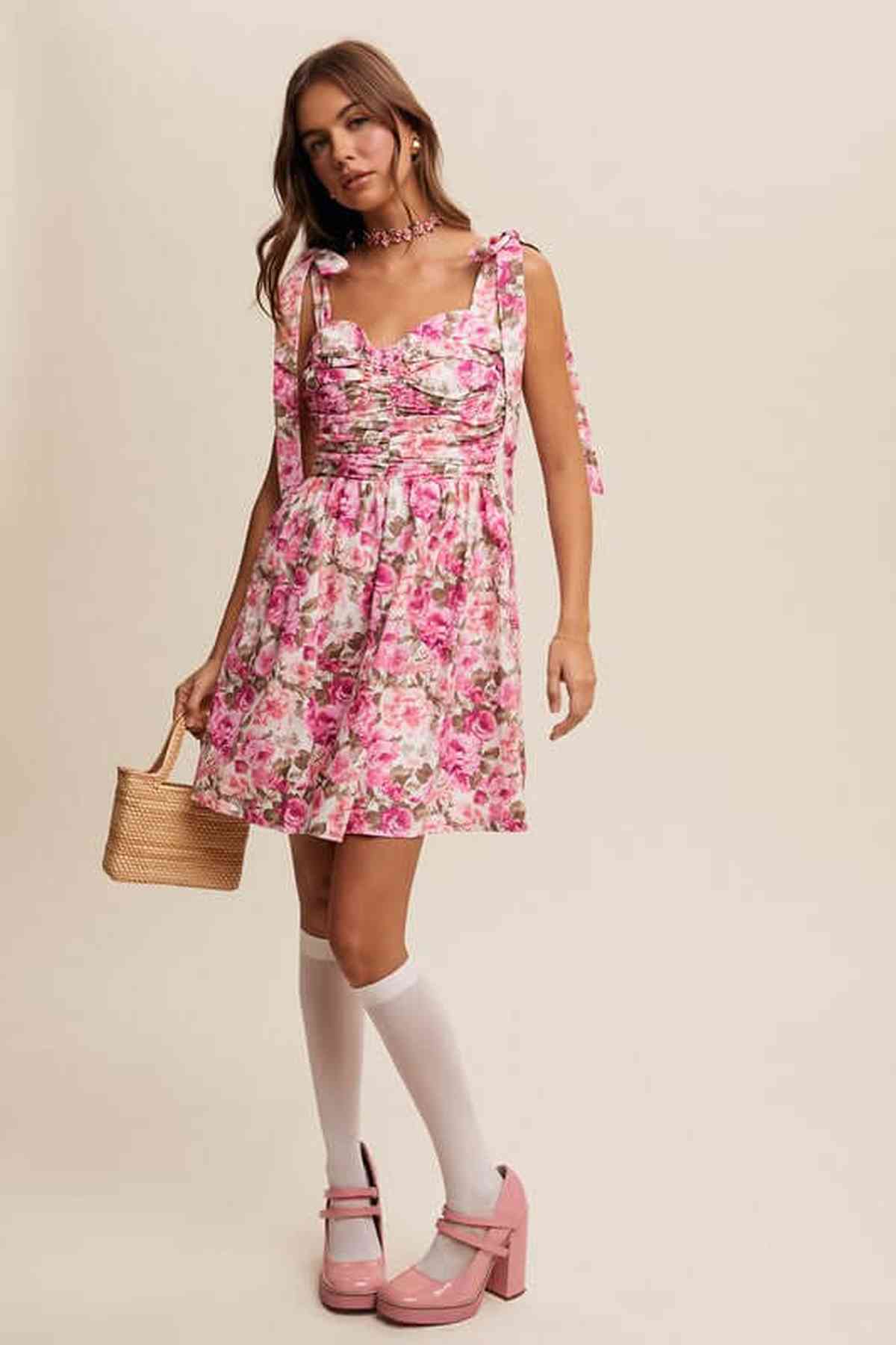 Model wearing the Lilia Mini Dress, a floral mini dress for women, perfect for summer occasions and casual outings.