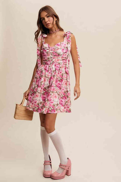 Model wearing the Lilia Mini Dress, a floral mini dress for women, perfect for summer occasions and casual outings.