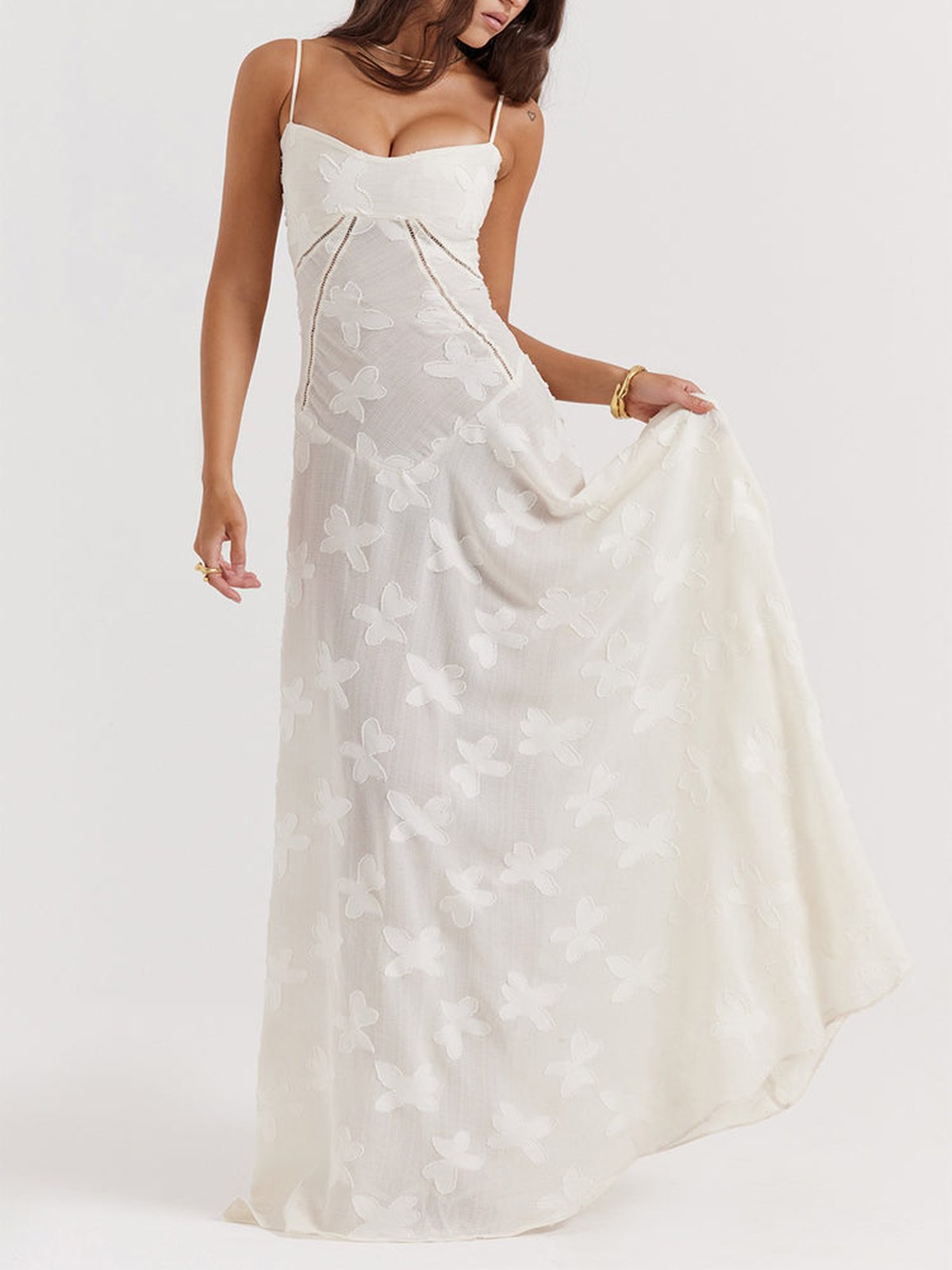 Ethereal white Lily Maxi Dress with lace detailing and spaghetti straps, perfect for summer weddings or formal events.