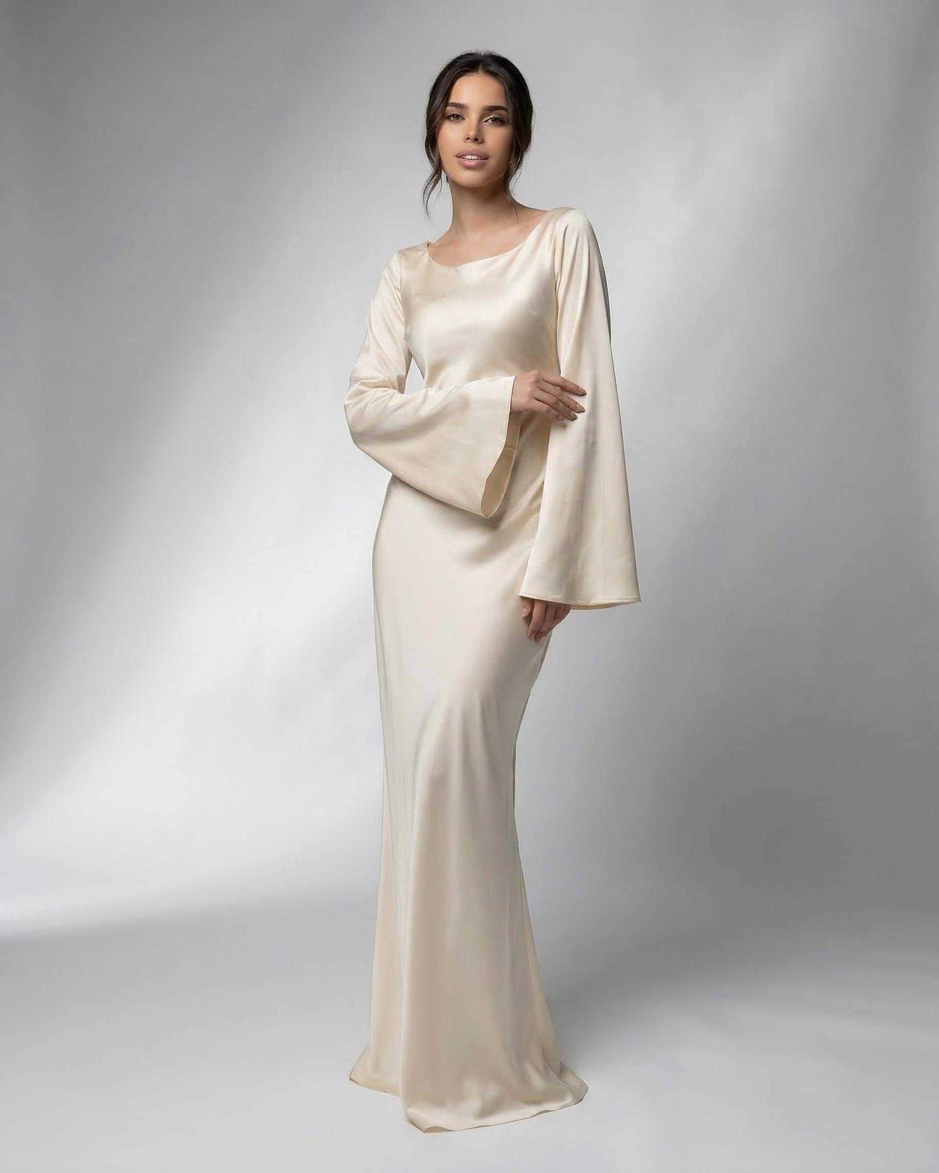 Liora Maxi Dress by Lauven features elegant bell sleeves and luxurious satin fabric in cream color.